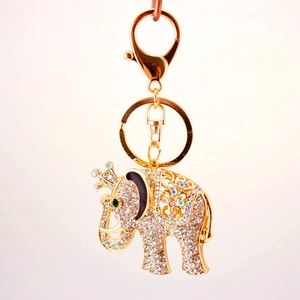 Sparkling elephant keychain with rhinestones and crown on a gold-plated metal ring