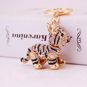 Portachiavi tigre scintillante in metallo dorato con strass bianchi lucidi