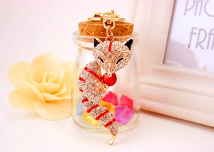 Detail of crystal fox keychain with gold metal plating and sparkling rhinestones