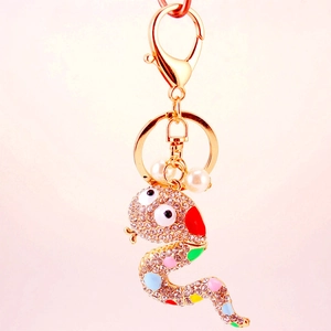 Colorful rhinestone snake keychain in gold alloy with pearls and crystals