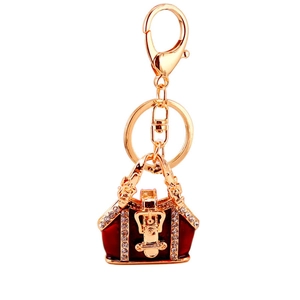 Porte-clés doré avec pendentif sac à main en émail rouge et cristaux brillants pour femmes