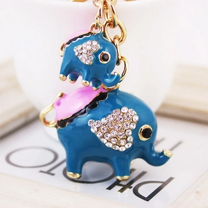 Porte-clés éléphant mère et bébé avec émail bleu, strass scintillants et métal doré