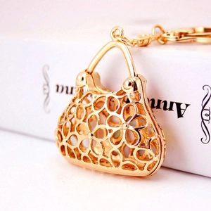 Golden hollow floral handbag keychain with sparkling metal chain for women's gift