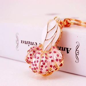Charming cabbage shaped keychain with gold plating, pink enamel and sparkling crystals