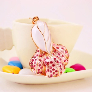 Goldfish car keychain with white enamel and pink crystals in rose gold finish