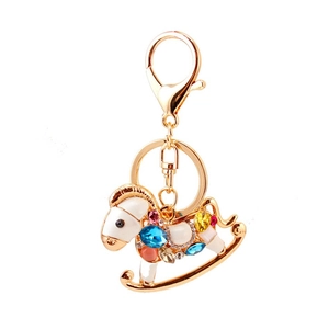 Portachiavi a cavallo a dondolo dorato con smalto bianco e strass colorati per borse da donna
