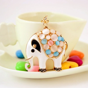Creative elephant keychain with opal stones and white enamel on a gold metal base