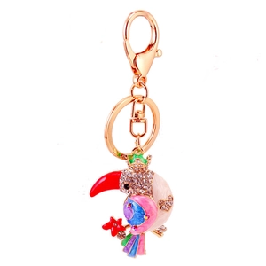 Colorful toucan keychain with sparkling rhinestones and vibrant enamel on gold metal