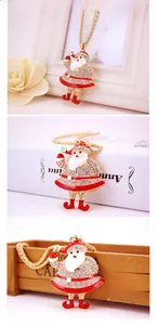 Macro detail of Santa Claus pendant with gold chain and colorful rhinestones in holiday set