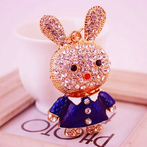 Porte-clés lapin étincelant avec strass et émail bleu marine sur cadre en métal doré