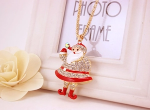 Detail of Christmas Santa pendant with red enamel and crystals on golden bead chain