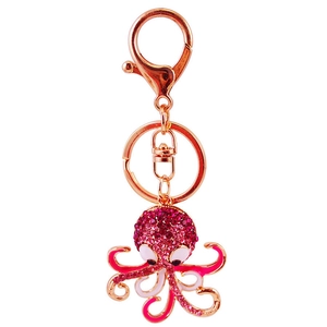 Octopus keychain with rose gold plating and pink rhinestones on white background