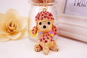 Detail of a pink crystal poodle keychain with sparkling rhinestones and gold-plated finish