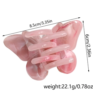 Detail view of 8.5cm pink marble acrylic butterfly hair claw clip with rhinestones