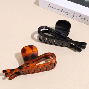 Set of large matte black and tortoiseshell hair claws for elegant hair styling