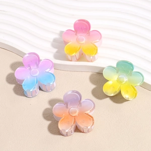 Set of four gradient plumeria hair claws in candy colors for elegant ponytail styling