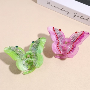 Elegant butterfly hair claws with crystals in light green and soft pink acetate
