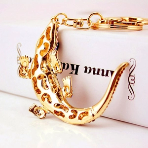 Sparkling gold-tone crocodile keychain with colorful rhinestones and lobster clasp