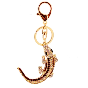 Sparkling crystal lizard keychain with gold metal plating and white rhinestones in a main view