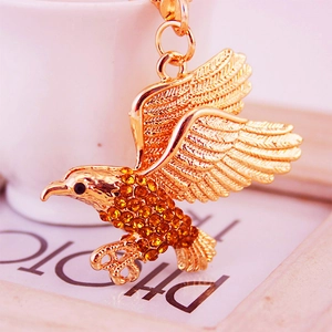 Goldener Adler Schlüsselanhänger mit funkelnden bernsteinfarbenen Strasssteinen