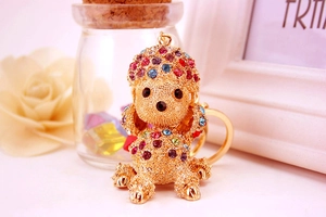 Close-up of golden poodle keychain featuring colorful rhinestones and premium metal ring
