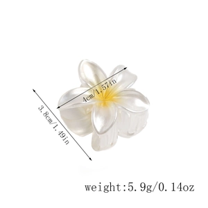 Detailed view of the small 4cm white and yellow plumeria flower hair claw clip