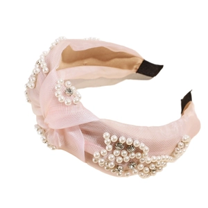 Pink mesh knot headband with vintage faux pearls and rhinestones on white background