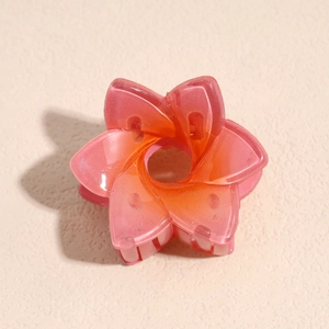 Vue détaillée d'une pince à cheveux fleur de 4cm avec dégradé rose-orange et fini mat