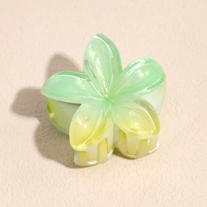 Detail view of Frangipani hair claw clip with gradient green acrylic and pearlescent finish