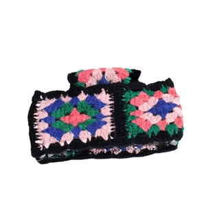 Handmade crochet floral headband with colorful granny square patterns for outdoor styling