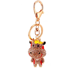 Porte-clés vache en cristal scintillant avec fermoir doré et strass blancs brillants