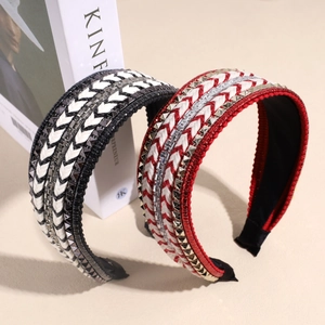 Knotted wide headband with metallic studs and crystal beads on woven fabric