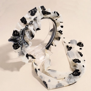 Serre-tête élégant en mesh blanc cassé avec papillon en strass noirs et longs rubans