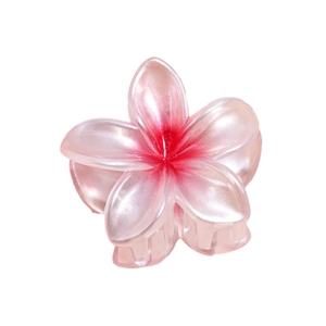 Pink gradient frangipani hair claw clip with pearlescent finish on white background