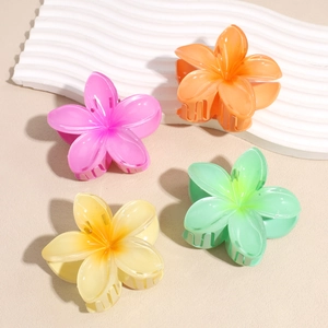 Colorful plumeria flower hair clips in pink, orange, yellow and green gradient set