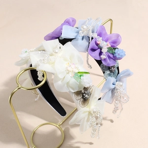Serre-têtes fleurs en tissu avec perles et pampilles dans des tons de couleurs pastel