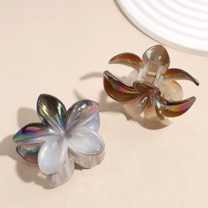 Elegant iridescent flower hair claws in blue-purple and amber gold tones with pearl finish