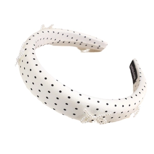 Polka dot padded headband with handmade pearl bow decorations for an elegant retro style