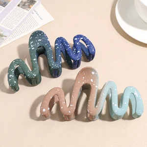 Large gradient wave claw clips in blue-green and brown colors with splash texture