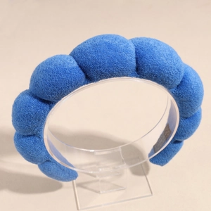 Détail du serre-tête éponge bleu marine avec texture douce en tissu éponge épais