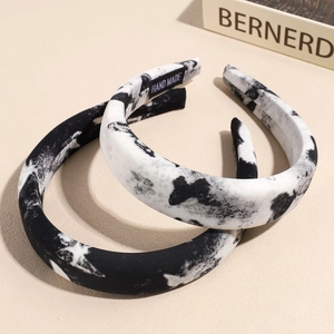 Ink style butterfly hairbands in black and white marble pattern with handmade tag