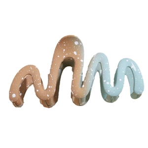 Large wavy gradient hair claw clip in blue and brown with artistic ink splatter design
