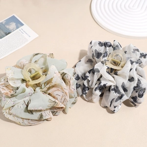 Floral and butterfly mesh bow hair claws in mint green and white for elegant styling