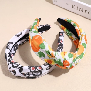 Set of two knot headbands with Halloween skull patterns and autumn pumpkin floral designs