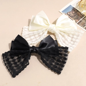 Elegant satin and lace bow hair clips set in black and cream with floral embroidery