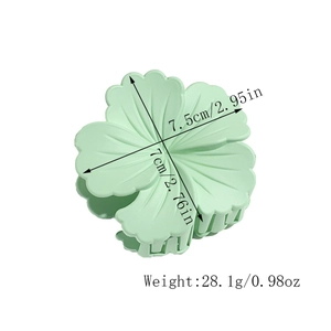 Detailed view of mint green matte flower hair claw clip with size measurements 7.5cm