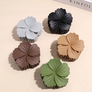 5-piece matte flower hair claw clips in neutral colors on a minimalist beige background