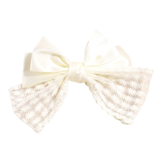 Elegant satin and lace bow hair clip in creamy white for a stylish ponytail look