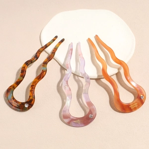 Elegant U-shaped acetate hair pins with wave design and sparkling rhinestone accents