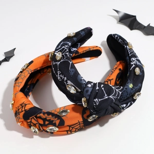 Halloween knot headbands featuring spider web and skull patterns with sparkly rhinestones